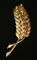 Lot 231 - A gold, ruby and diamond ears of wheat brooch
