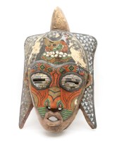 Lot 417 - A North African carved tribal mask with beadwork detail