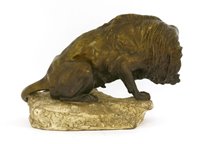 Lot 240 - A lion cleaning his paw
