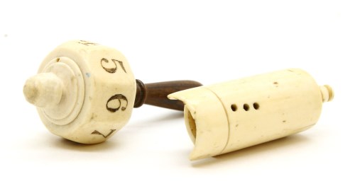 Lot 173 - An ivory and rosewood spinning dice numbered 1-8