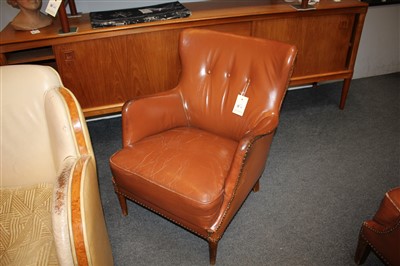 Lot 68 - A pair of brown leather chairs