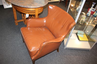 Lot 68 - A pair of brown leather chairs