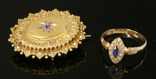 Lot 647 - An 18ct gold Edwardian sapphire and diamond marquise cluster ring