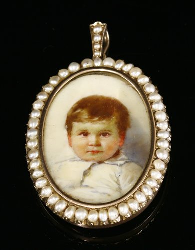 Lot 88 - An Edwardian gold and split pearl set painted miniature portrait of a young child, c.1910