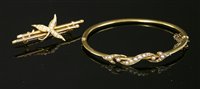 Lot 640 - A 15ct gold Victorian split pearl hinged bangle