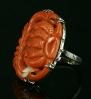 Lot 259 - A white gold carved coral ring
