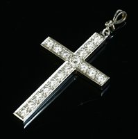 Lot 557 - A white gold diamond set flat section Latin cross