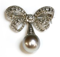 Lot 334 - A white gold Tahitian cultured pearl and diamond bow brooch