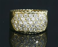 Lot 271 - An 18ct gold diamond set band ring