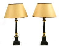 Lot 420A - A pair of late Victorian bronze table lamps and shades with blacked square reeded columns on flared and moulded square bases