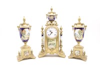Lot 398 - A 20th Century brass and porcelain clock garniture