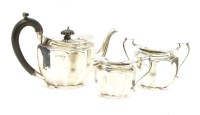 Lot 219 - A silver three piece tea set