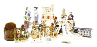 Lot 391 - A collection of Staffordshire figures and other items including a pottery cradle