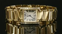 Lot 412 - A ladies 18ct gold Cartier Tank Francaise quartz bracelet watch