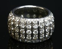 Lot 534 - A white gold diamond set 'D' section band ring