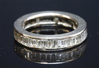 Lot 554 - A white gold baguette diamond full eternity ring