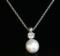 Lot 384 - An 18ct white gold diamond and South Sea pearl pendant