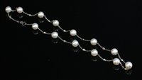 Lot 336 - An 18ct white gold cultured pearl and diamond necklace