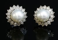 Lot 438 - A pair of white gold South Sea cultured pearl and diamond cluster earrings
