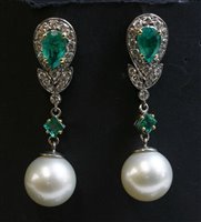 Lot 388 - A pair of two colour gold emerald, diamond and South sea pearl drop earrings