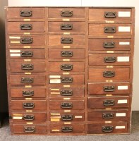 Lot 625 - A Victorian grained pine seed merchant's cabinet