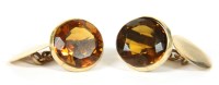 Lot 102 - A pair of gold single stone citrine chain link cufflinks