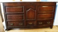 Lot 650 - An 18th century oak mule chest