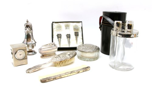 Lot 357 - A set of three plated and glass drinks flasks