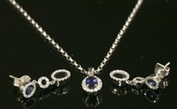 Lot 669 - A white gold sapphire and diamond cluster pendant necklace and earring suite