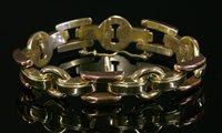 Lot 217 - A Continental two colour gold hollow bracelet