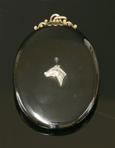 Lot 69 - A Victorian gold oval onyx glazed pendant/brooch picture locket