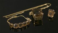 Lot 253 - A gold smokey quartz matched pendant, brooch/pendant, bracelet and ring suite