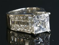 Lot 145 - A white gold single stone white sapphire ring