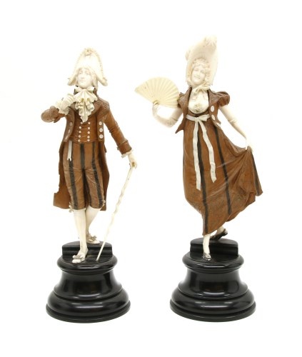 Lot 250 - A pair of late 19th century carved ivory and fruitwood figures