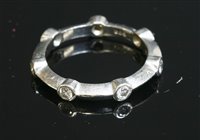 Lot 533 - A cased platinum diamond set band ring, by David Morris
