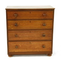 Lot 705 - A Victorian oak chest of four long drawers