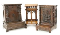 Lot 559 - Three carved oak `prie dieu' kneelers