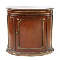 Lot 585 - A mid 19th Century mahogany bow front cabinet