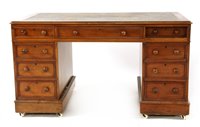 Lot 612 - A Victorian walnut nine drawer pedestal desk