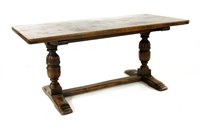 Lot 580 - An oak refectory table