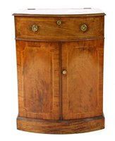 Lot 558 - A 19th Century mahogany bow front cabinet