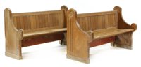 Lot 502 - A pair of short carved oak pews