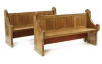 Lot 553 - A pair of short carved oak pews