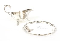 Lot 109 - A silver waiter and a silver sauce boat