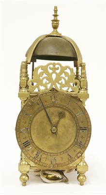 Lot 728 - A hook and spike brass lantern clock