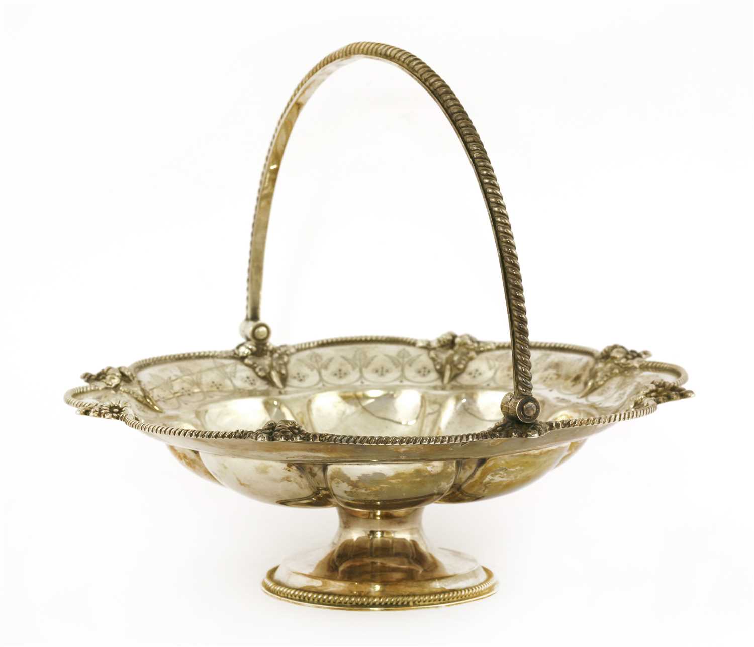 Lot 16 - A Victorian swing-handled silver cake basket