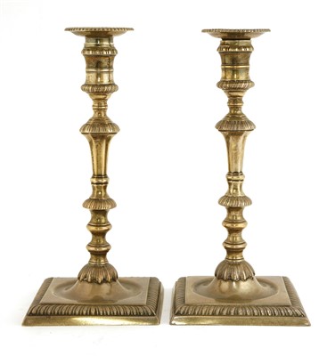 Lot 123 - A pair of George II silver candlesticks