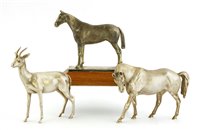 Lot 120 - Two silver horse figures