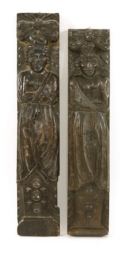 Lot 722 - A pair of carved oak term figures