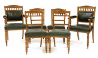 Lot 535 - A set of fourteen late Victorian pale oak dining chairs